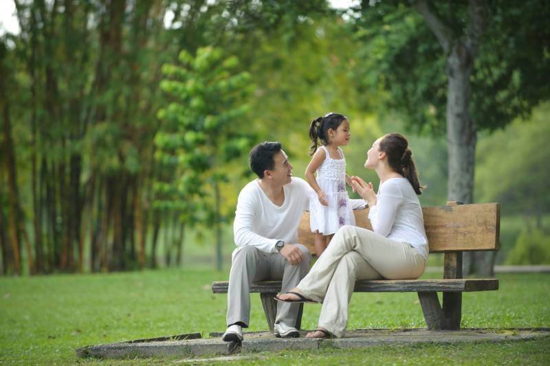 happy family at the park covered by an integrated shield plan