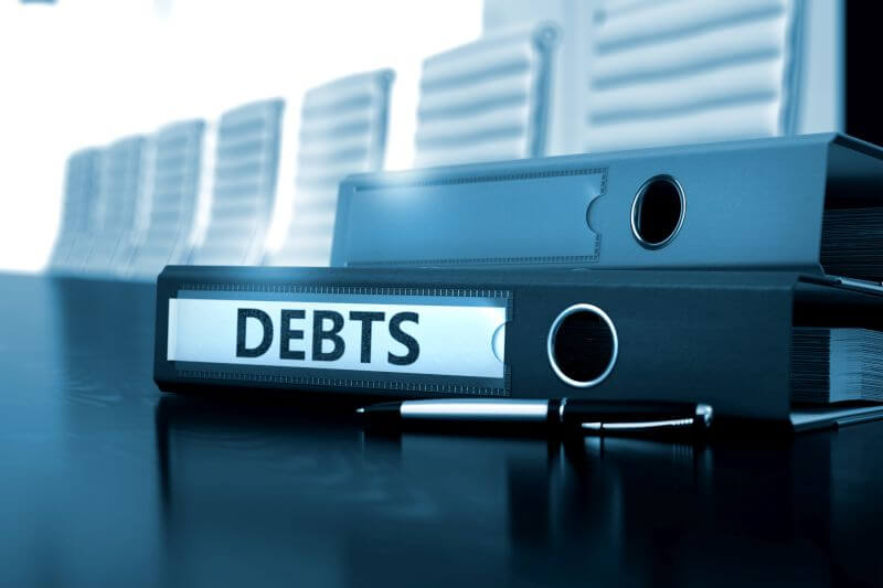 piling debts. Surrendering insurance policies to raise money