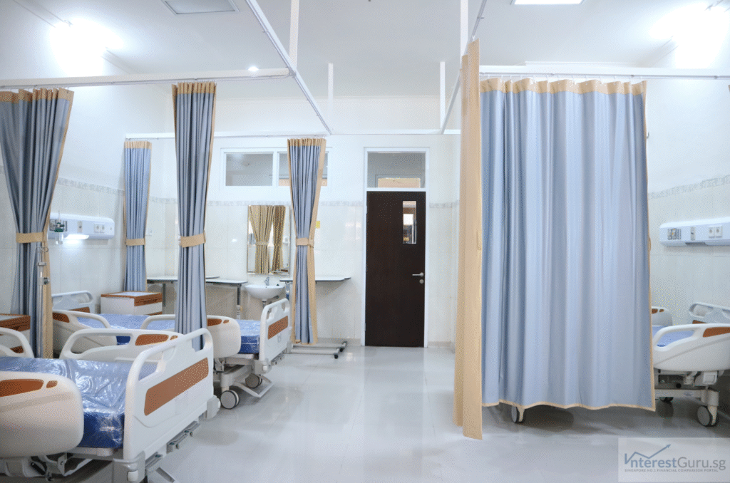 Public hospital ward in Singapore showing empty beds and medical equipment, highlighting healthcare costs without insurance